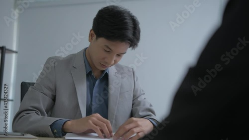 Business concept of 4k Resolution. The client is submitting a pay offer to the staff in the office.
