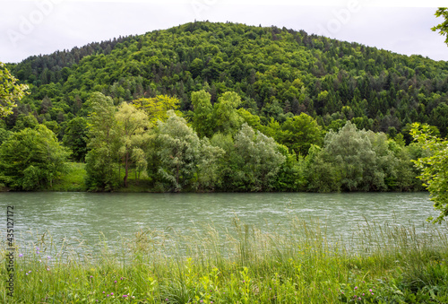 Scenic landscape of hills. View of he Savinja river with rural surroundings in Celje. Celje is the third-largest town in Slovenia.