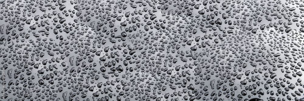 Rain water drops on metallic surface Rain water drops on metallic surface