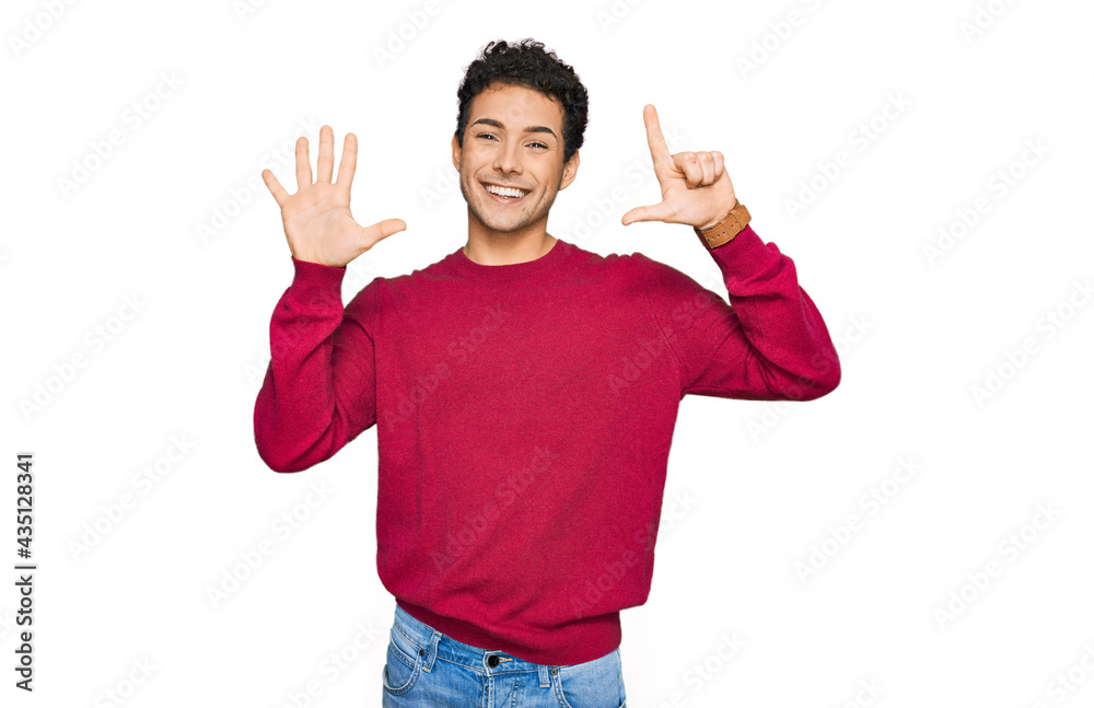 Young handsome man wearing casual clothes showing and pointing up with fingers number seven while smiling confident and happy. Young handsome man wearing casual clothes showing and pointing up with fingers number seven while smiling confident and happy.