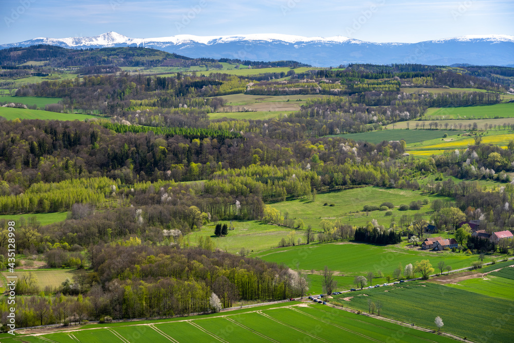 view on Sudety Mountains with Karkonosze during spring sunny day in Poland