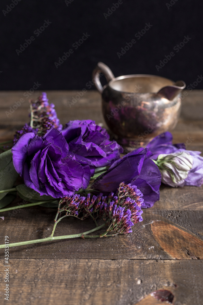 bunch of lilac flowers on wooden background