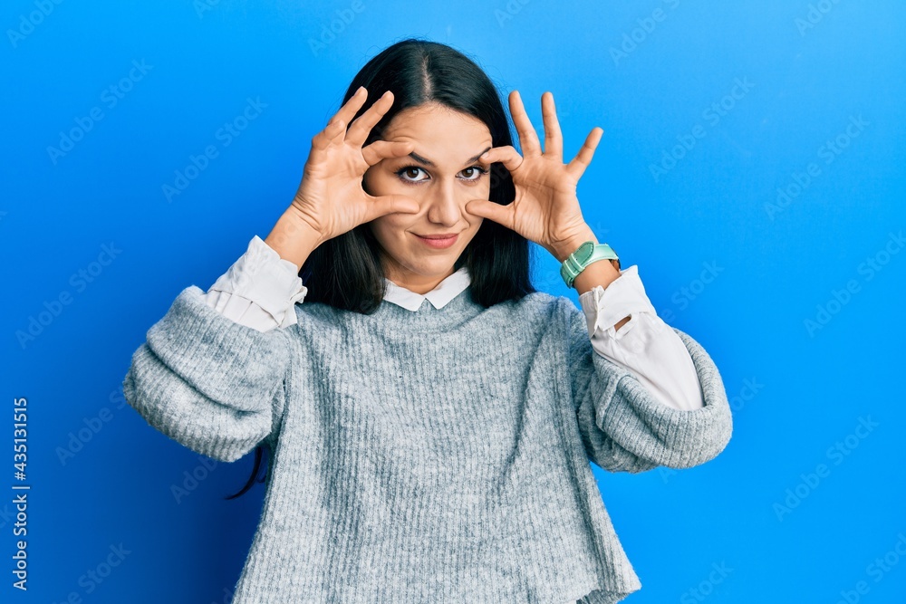Young hispanic woman wearing casual clothes trying to open eyes with fingers, sleepy and tired for morning fatigue Young hispanic woman wearing casual clothes trying to open eyes with fingers, sleepy and tired for morning fatigue
