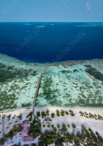 Maldives resort island drone aerial view, Indian ocean atoll nature beach and palm forest, leisure tourist luxury vacation