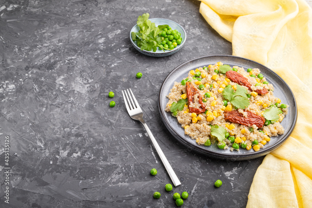 Quinoa porridge with green pea, corn and dried tomatoes on ceramic plate on a gray concrete background. Side view, copy space. Quinoa porridge with green pea, corn and dried tomatoes on ceramic plate on a gray concrete background. Side view, copy space.