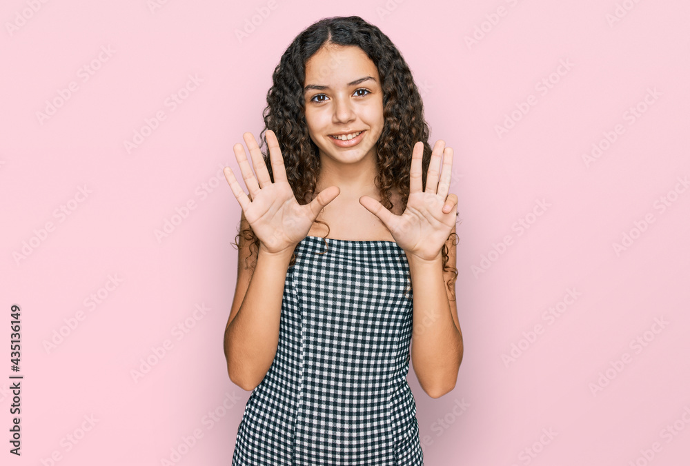 Teenager hispanic girl wearing casual clothes showing and pointing up with fingers number nine while smiling confident and happy. Teenager hispanic girl wearing casual clothes showing and pointing up with fingers number nine while smiling confident and happy.