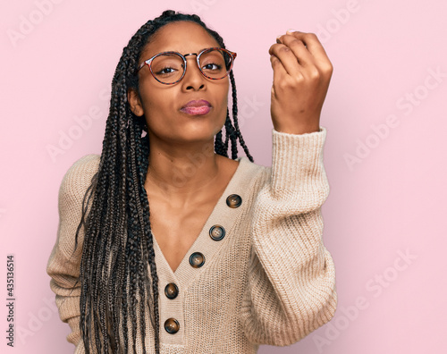African american woman wearing casual clothes doing italian gesture with hand and fingers confident expression