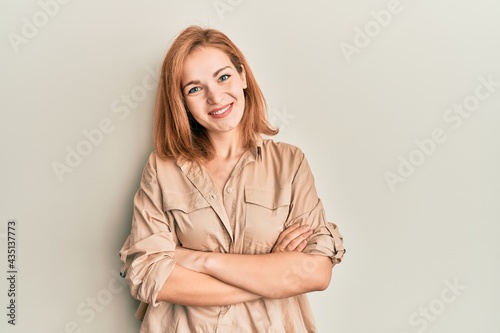 Young caucasian woman wearing casual clothes happy face smiling with crossed arms looking at the camera. positive person.