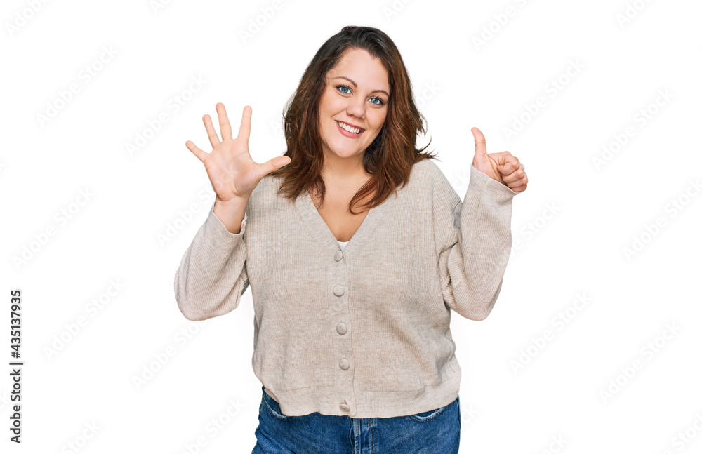 Young plus size woman wearing casual clothes showing and pointing up with fingers number six while smiling confident and happy.