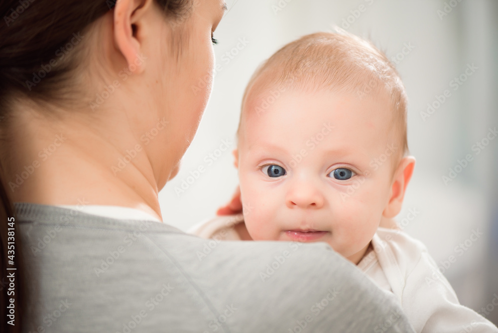 Mother and baby, parent and little kid relaxing at home. Family having fun together. Mother and baby, parent and little kid relaxing at home. Family having fun together.