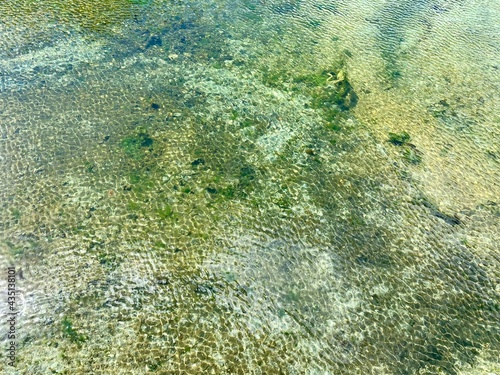 Fototapeta Naklejka Na Ścianę i Meble -  Top view sparkling water in the sunlight , looks like bee hives.
