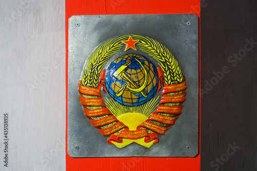 The image of the coat of arms of the Soviet Union on the wall