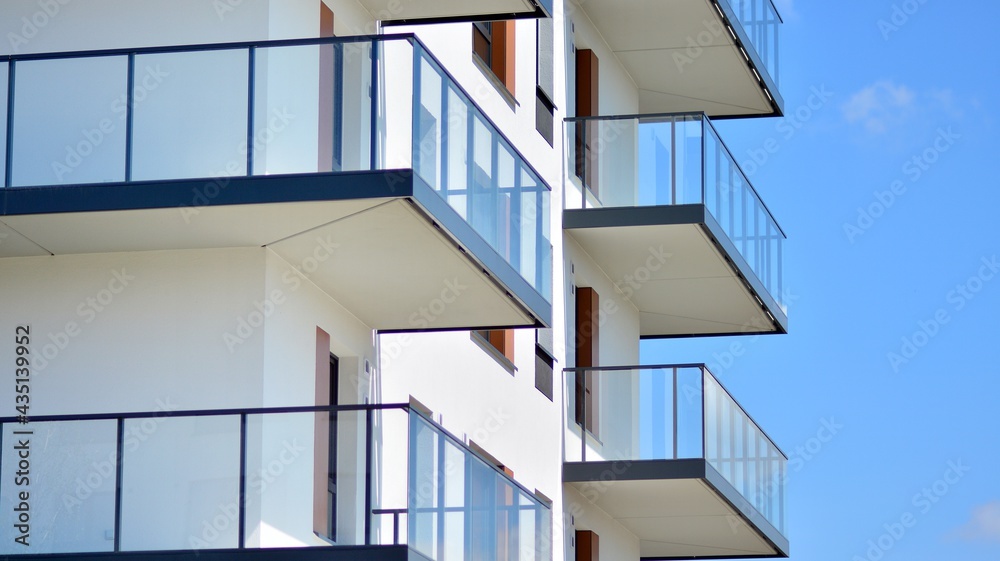 Condominium and apartment building with symmetrical modern architecture in the city downtown. Condominium and apartment building with symmetrical modern architecture in the city downtown.