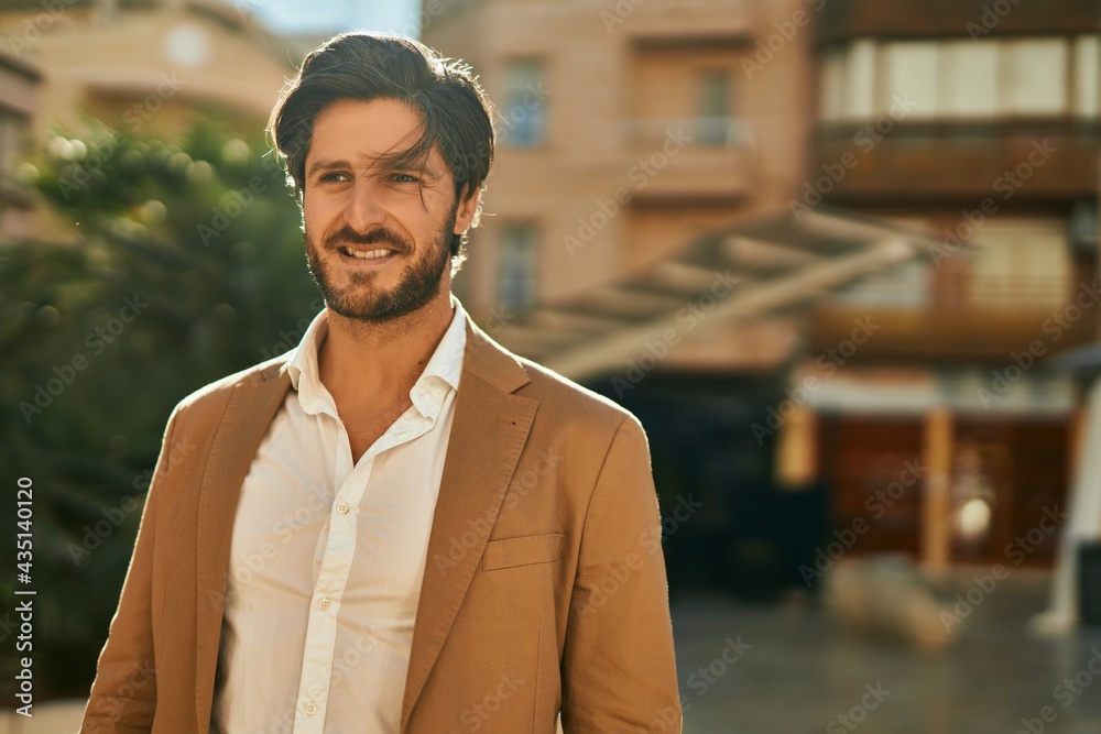 Young hispanic businessman smiling happy standing at the city. Young hispanic businessman smiling happy standing at the city.