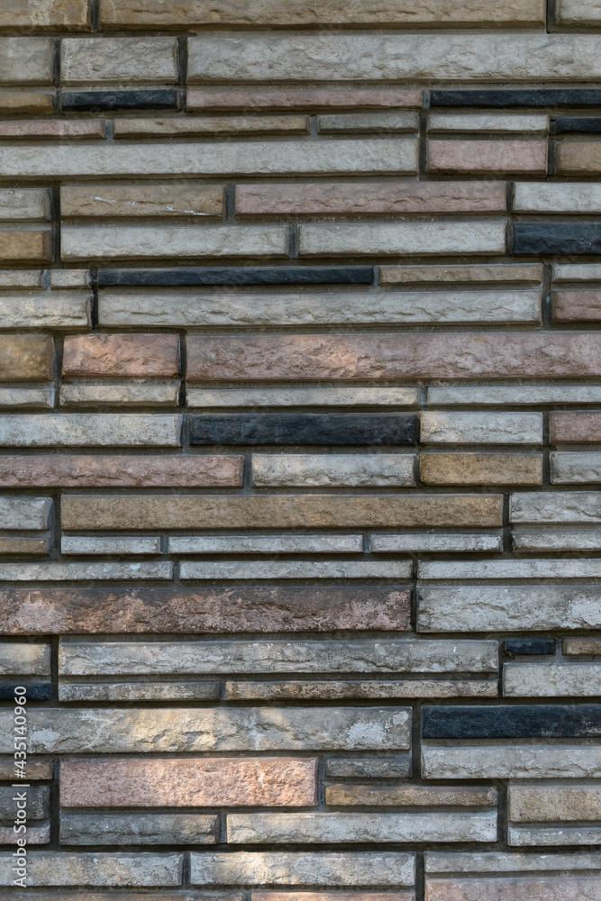 Wall of rectangular stones of different shapes and colors Wall of rectangular stones of different shapes and colors