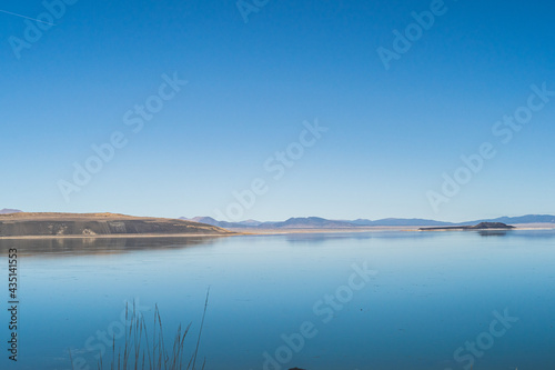 Mono lake, California in Autumn on sunny day with clear blue sky and tufa 