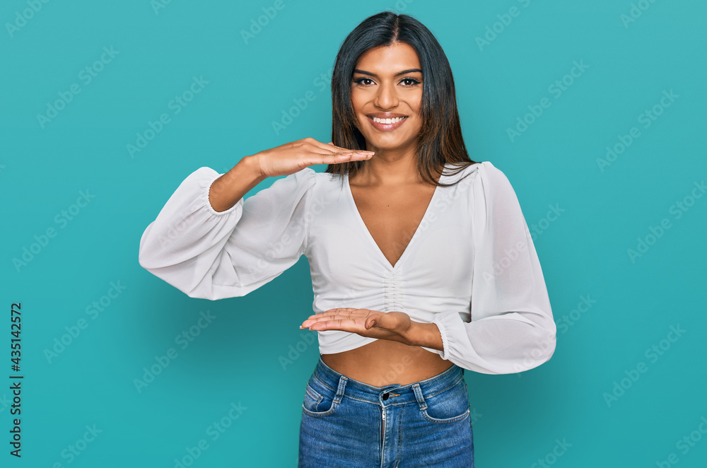 Young plus size woman wearing casual clothes gesturing with hands