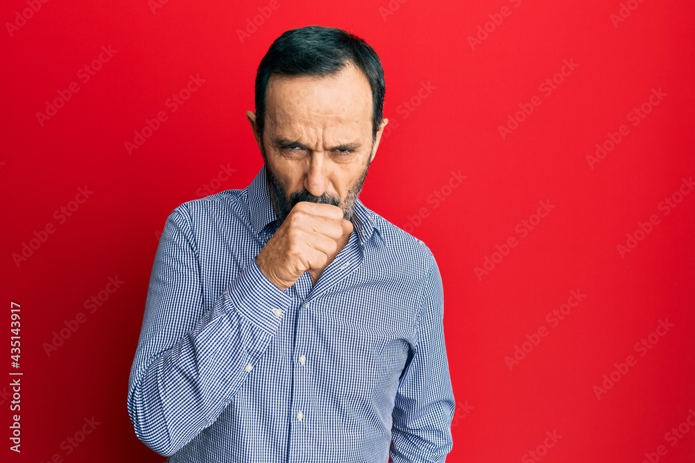 Middle age hispanic man wearing casual clothes feeling unwell and coughing as symptom for cold or bronchitis. health care concept. Middle age hispanic man wearing casual clothes feeling unwell and coughing as symptom for cold or bronchitis. health care concept.