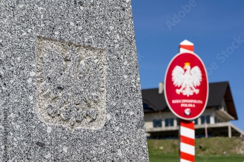 The obelisk and a Polish crest on Trojmezi point, the border between Czech Republic, Slovakia and Poland photo
