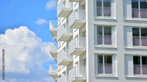 Condominium and apartment building with  symmetrical modern architecture in the city downtown.