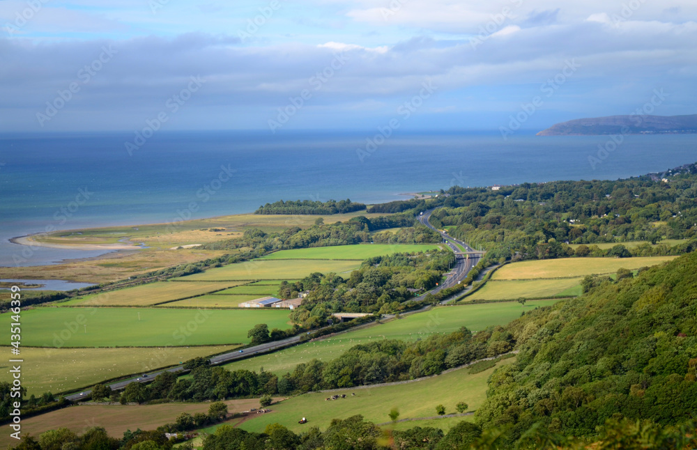 Aerial landscape view of a road near the coast. Curvy roadway in England, UK