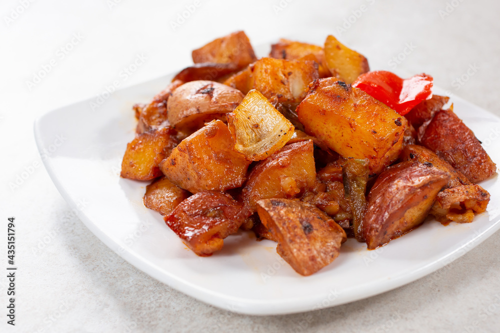 A view of a plate of roasted potatoes.