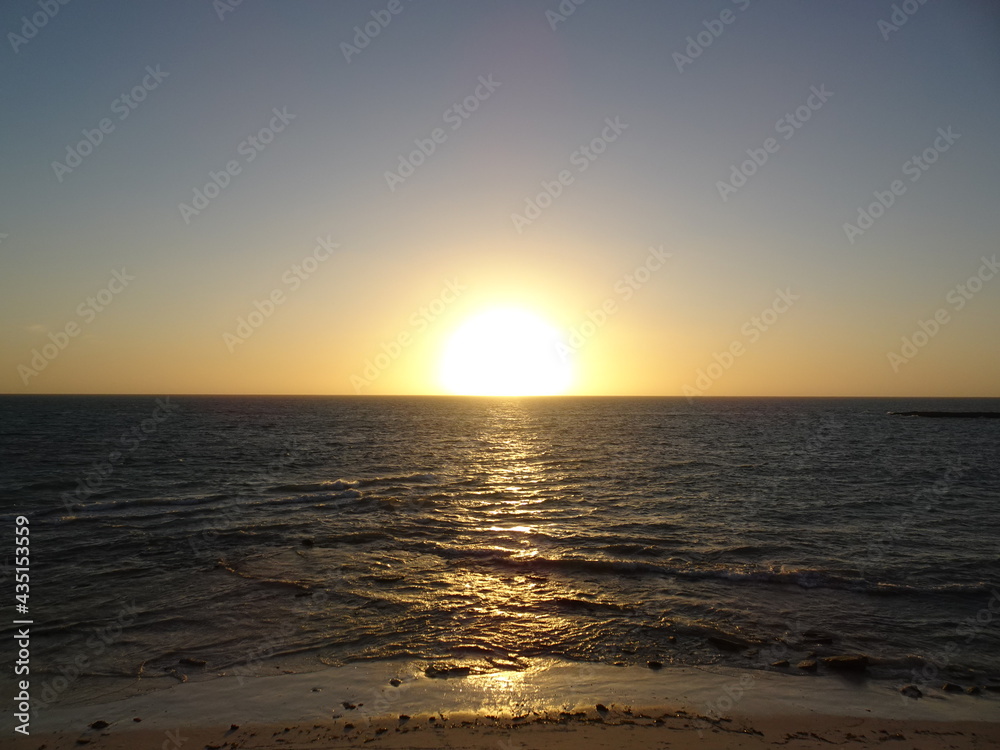 [Madagascar] The beach dyed orange and the sun setting on the horizon in Salary bay