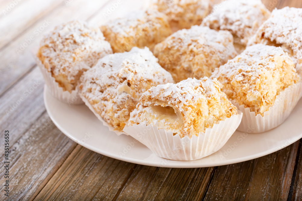A view of a plate of miniature Napoleon pastries. A view of a plate of miniature Napoleon pastries.
