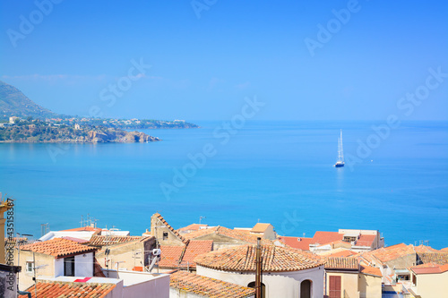 Sea views, tiled roofs and a sailboat in the distance