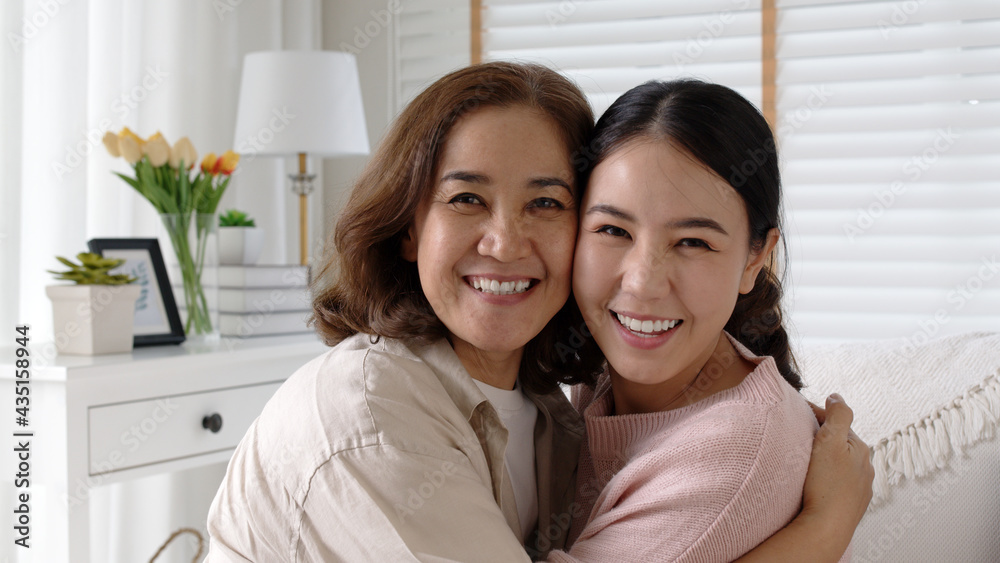 Attractive beautiful mum sit at cozy sofa couch living room in family moment grown up child kid look camera celebrate joy good warm time relationship with retired overjoy lady girl life insurance. Attractive beautiful mum sit at cozy sofa couch living room in family moment grown up child kid look camera celebrate joy good warm time relationship with retired overjoy lady girl life insurance.