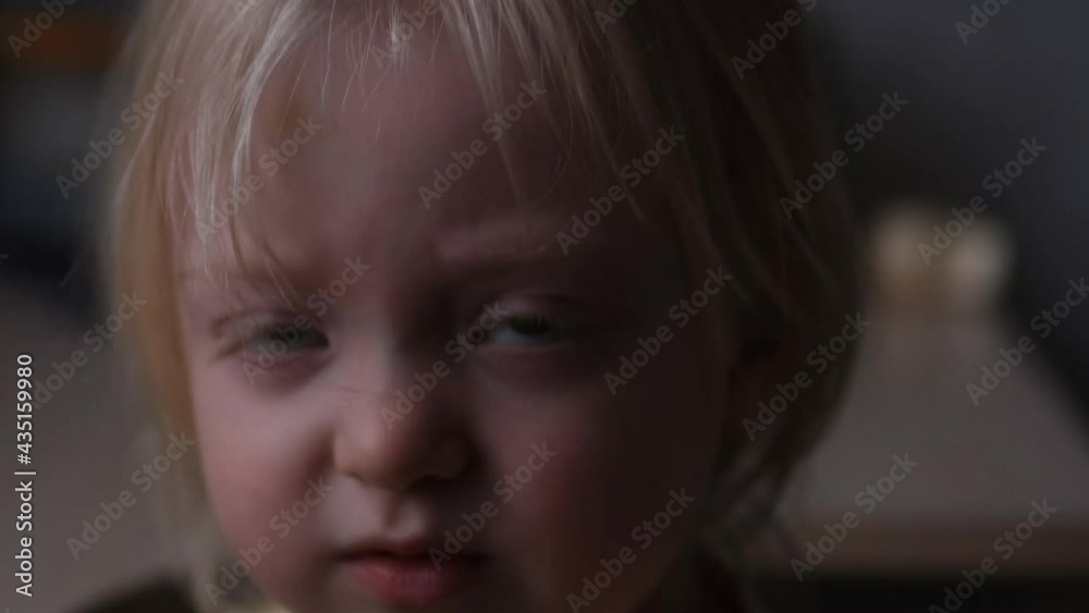 Cute little child happily hugs a fresh bun. Girl wants to eat bread with gluten. Homemade baking Cute little child happily hugs a fresh bun. Girl wants to eat bread with gluten. Homemade baking