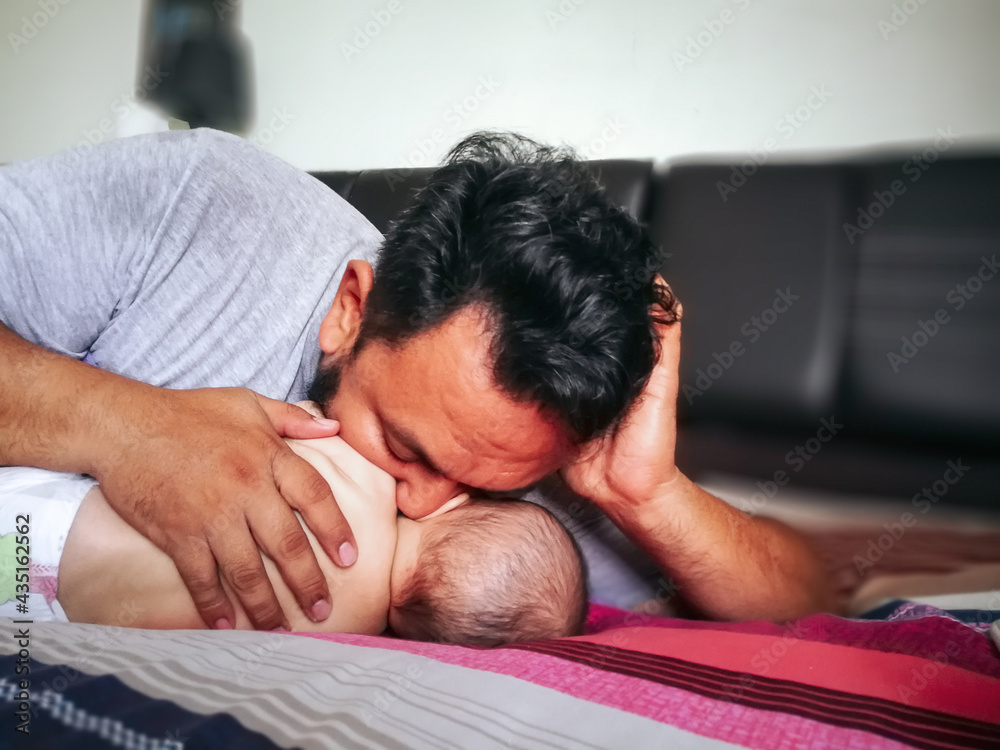 family, fatherhood and people concept - happy father holding little baby daughter. family, fatherhood and people concept - happy father holding little baby daughter.