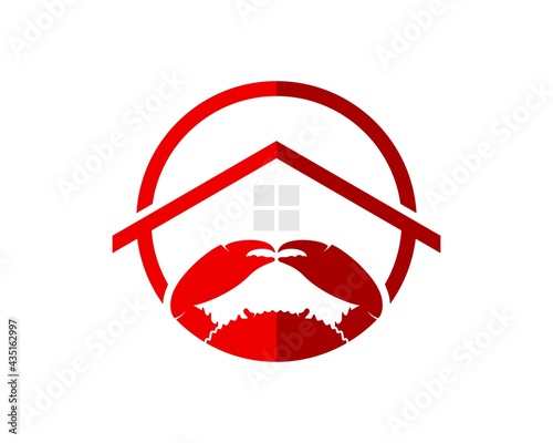 Circular shape with red crab and house inside
