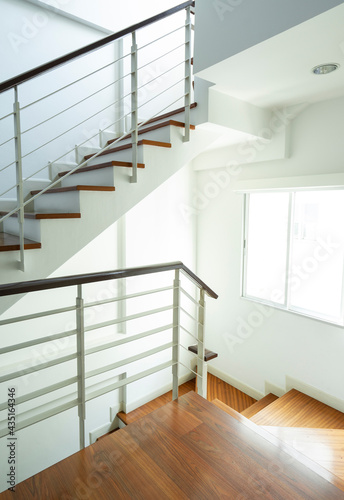 Wooden staircase and staircase railing handle for safety.