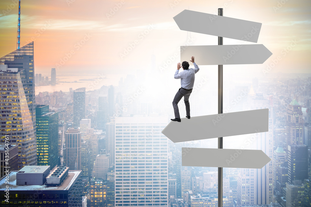 Businessman at the crossroads choosing strategy Businessman at the crossroads choosing strategy