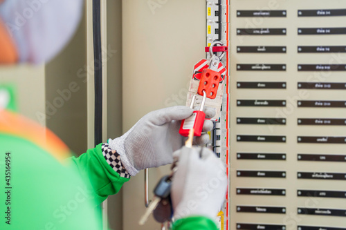Lockout Tag-out. Working safety with electrical. Key lock circuit breaker at main distribution.