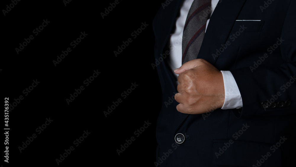 businessman in suit on a black background. studio shot with copy space.