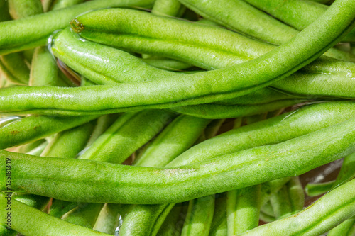 green beans on a white background © Rajesh