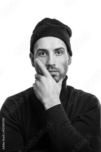 black and white portrait of a thoughtful young man.