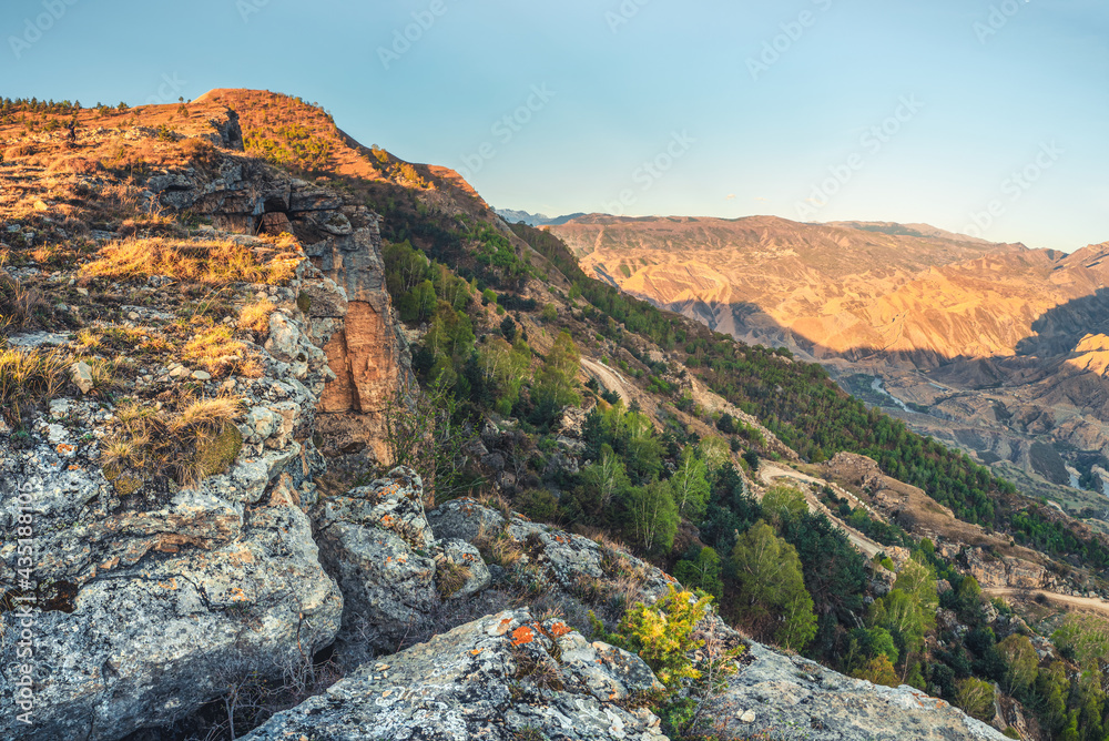 The Keger plateau in Dagestan. Morning sunrise view of the valley and the gorge with the river. The Keger plateau in Dagestan. Morning sunrise view of the valley and the gorge with the river.