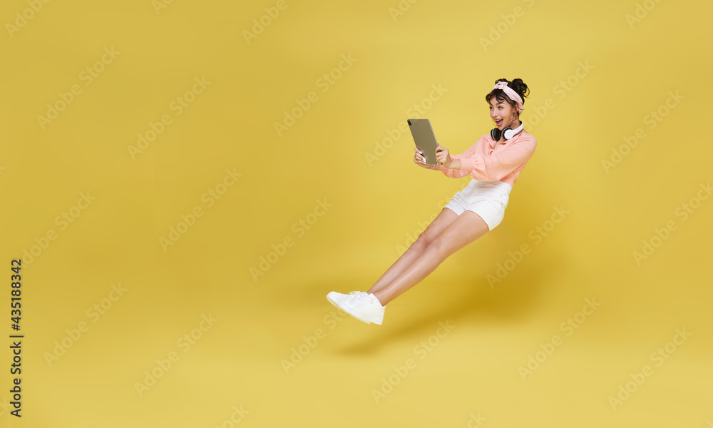 Young asian teenage girl hand holding computer laptop floating in mid ...