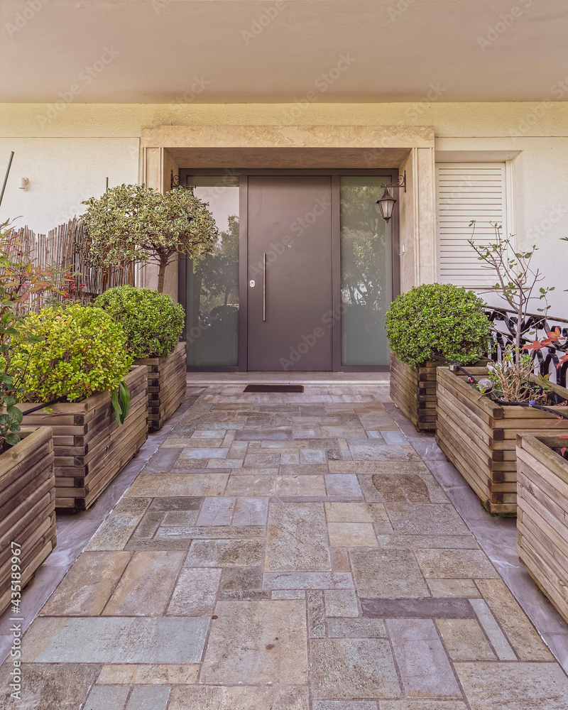 modern family house front entrance stone covered corridor to metal and glass door modern family house front entrance stone covered corridor to metal and glass door