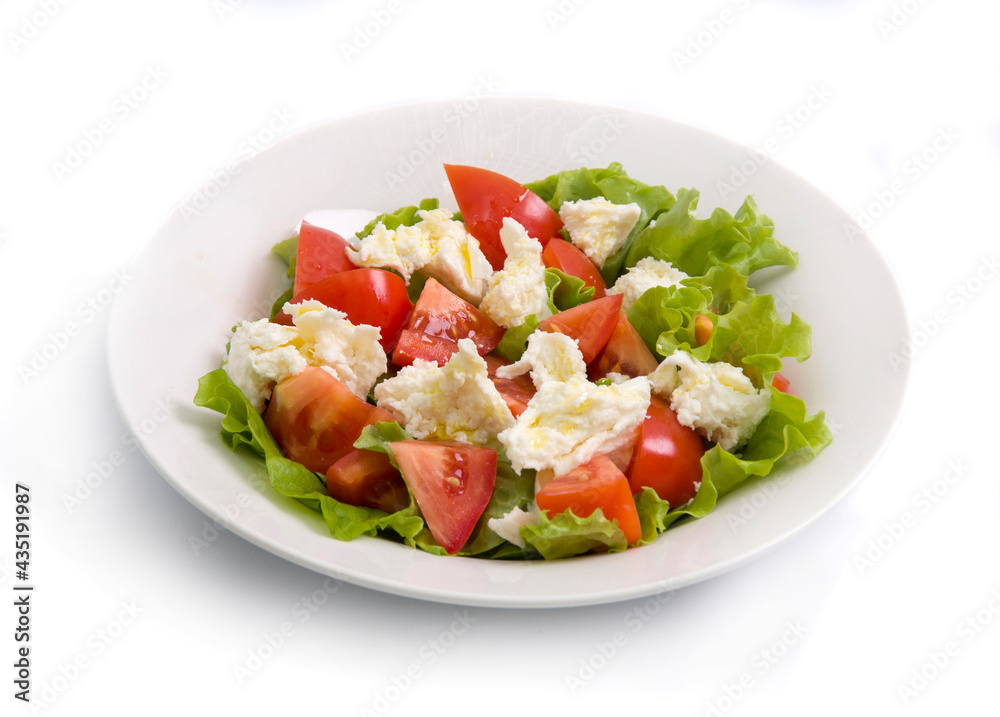 salad with tomatoes and feta cheese isolated