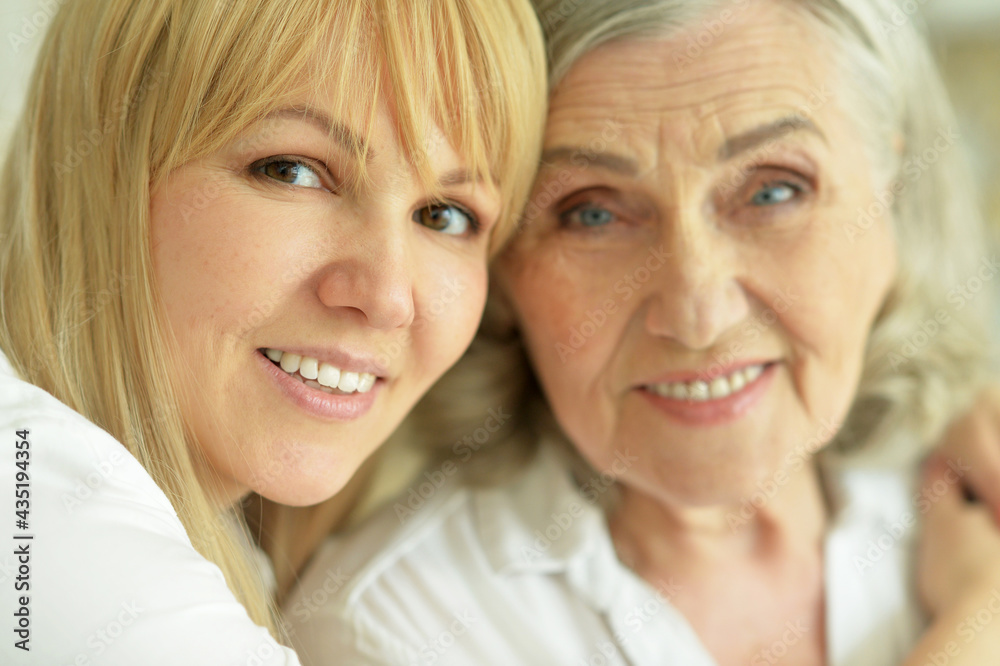 portrait of smiling mother and daughter portrait of smiling mother and daughter