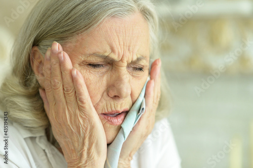 Close up portrait of sick senior woman