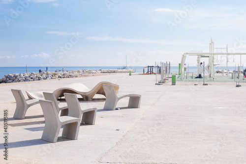 horizontal bars and sports playground on the beach on a sunny day