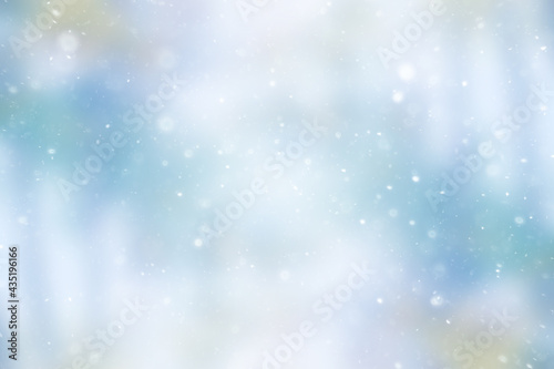 blurred snow / winter abstract background, snowflakes on abstract blurred glowing leaf background © kichigin19