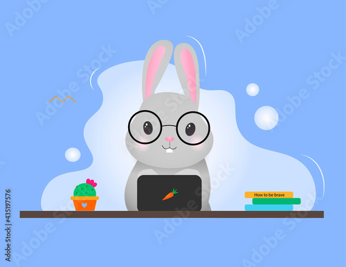 Sweet gray rabbit at the computer. Rabbit working at the table with laptop. Vector illustration	