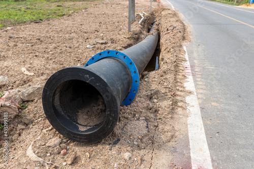 Wallpaper Mural Construction site with new Water Pipes in the ground. sewer pipes to repair or restore in street city Torontodigital.ca