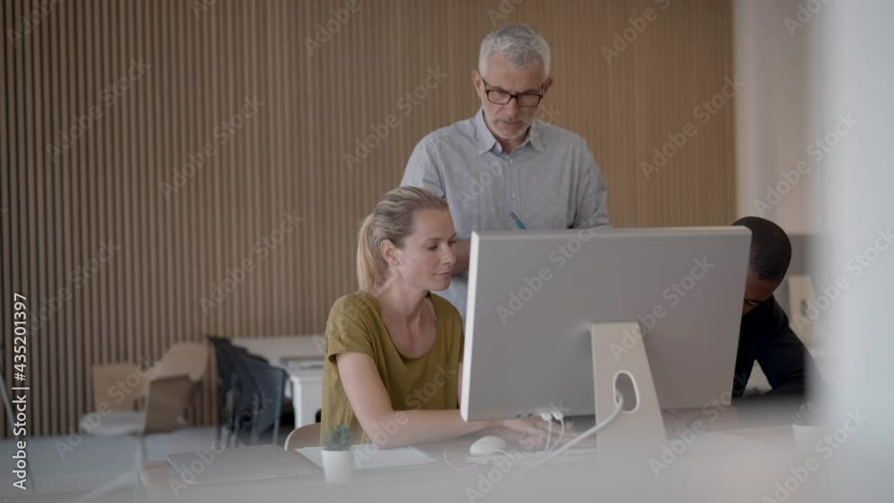 Business people in modern meeting room working together on project Business people in modern meeting room working together on project